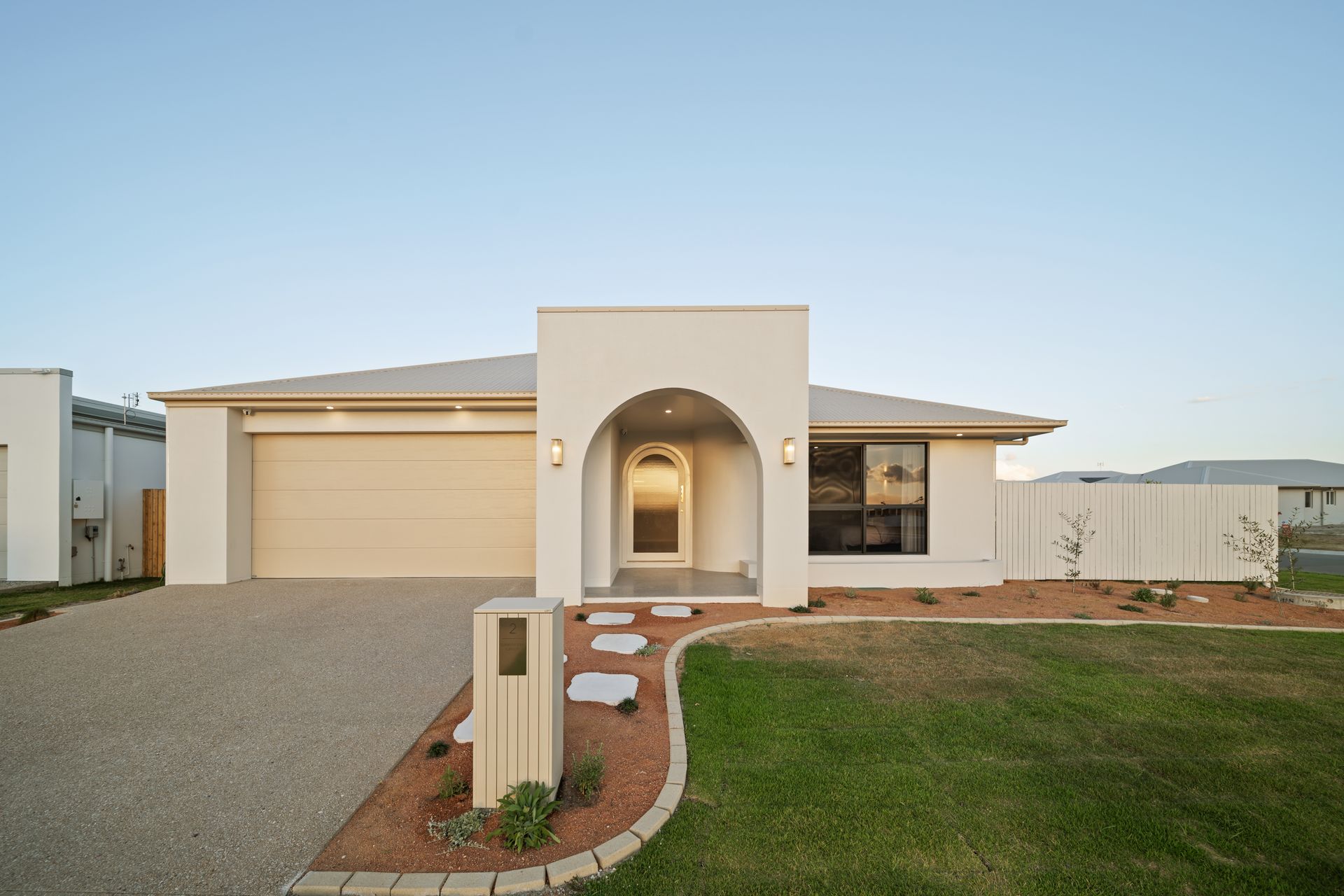 Modern Single-Story House With a Beige Garage — Simon Bell Constructions in Alice River, QLD