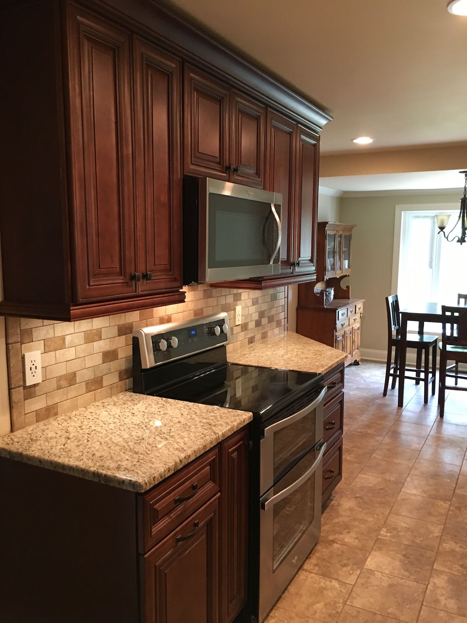 a kitchen with stainless steel appliances and granite counter tops
