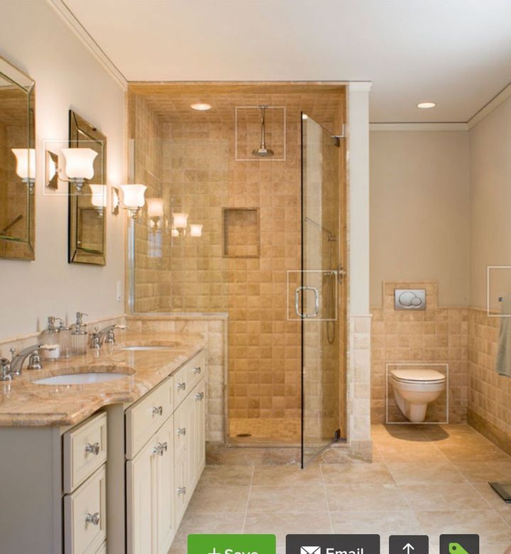 a bathroom with two sinks a toilet and a shower