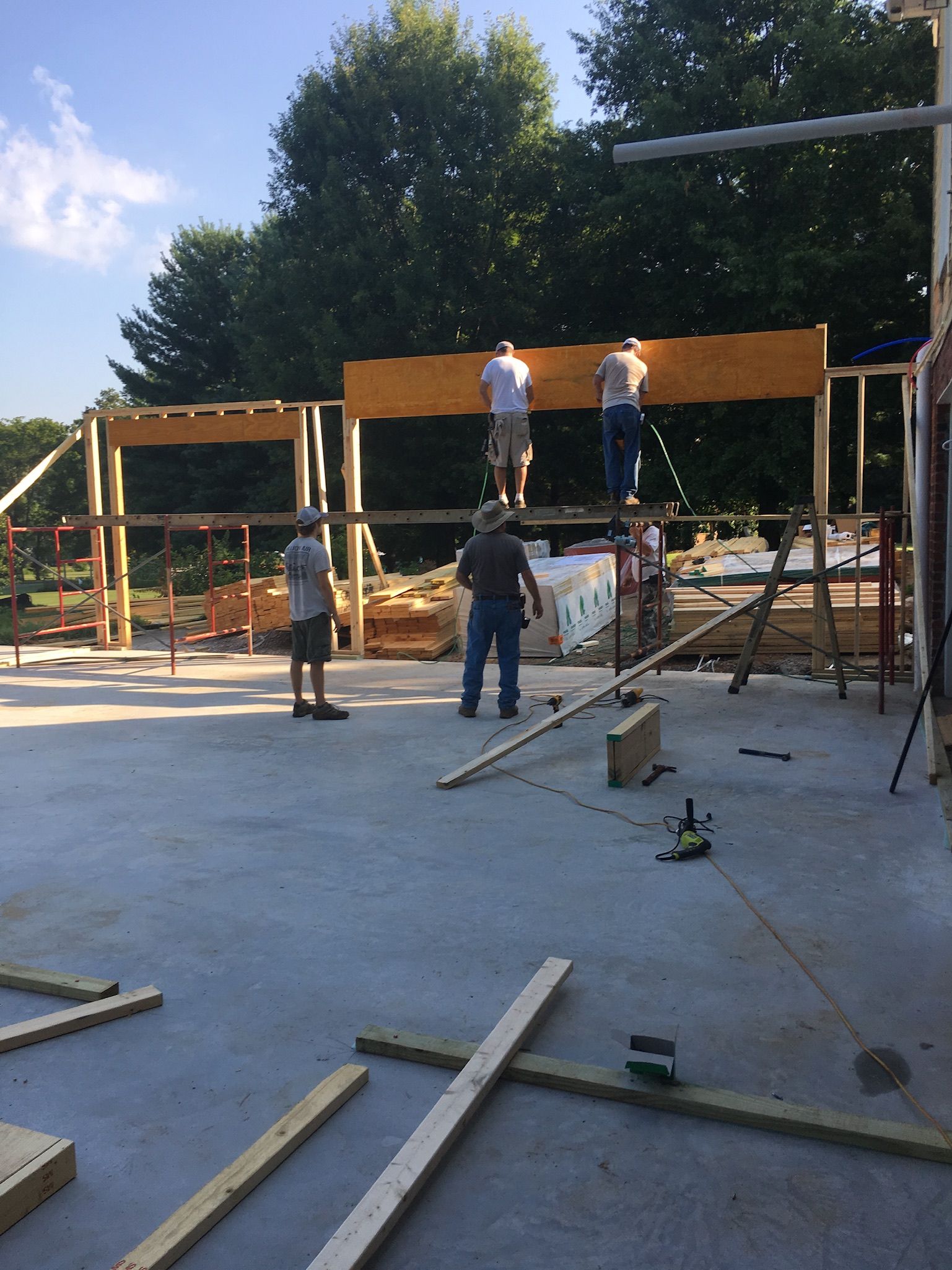 a group of men are working on a construction site