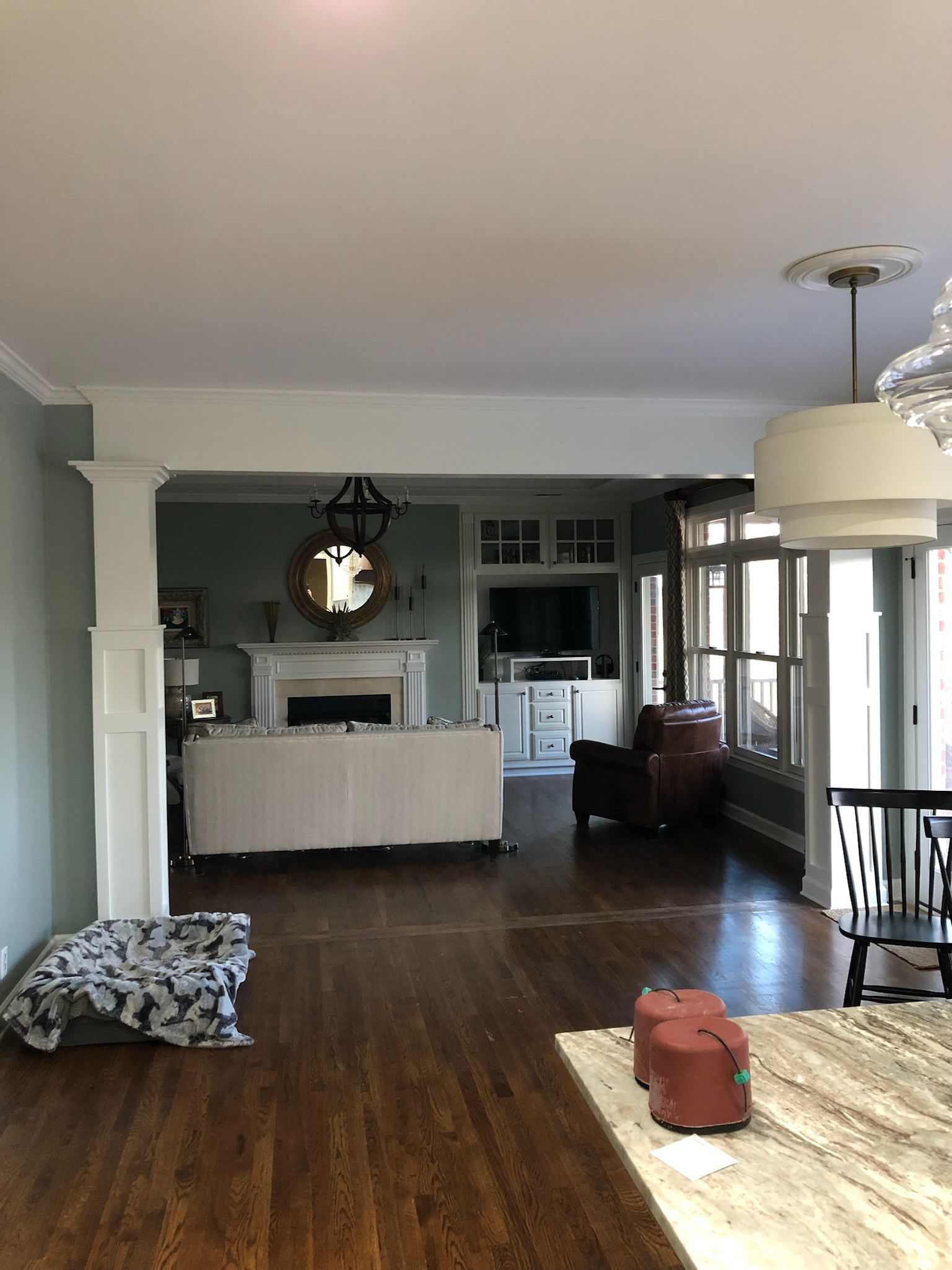a living room with hardwood floors and a fireplace