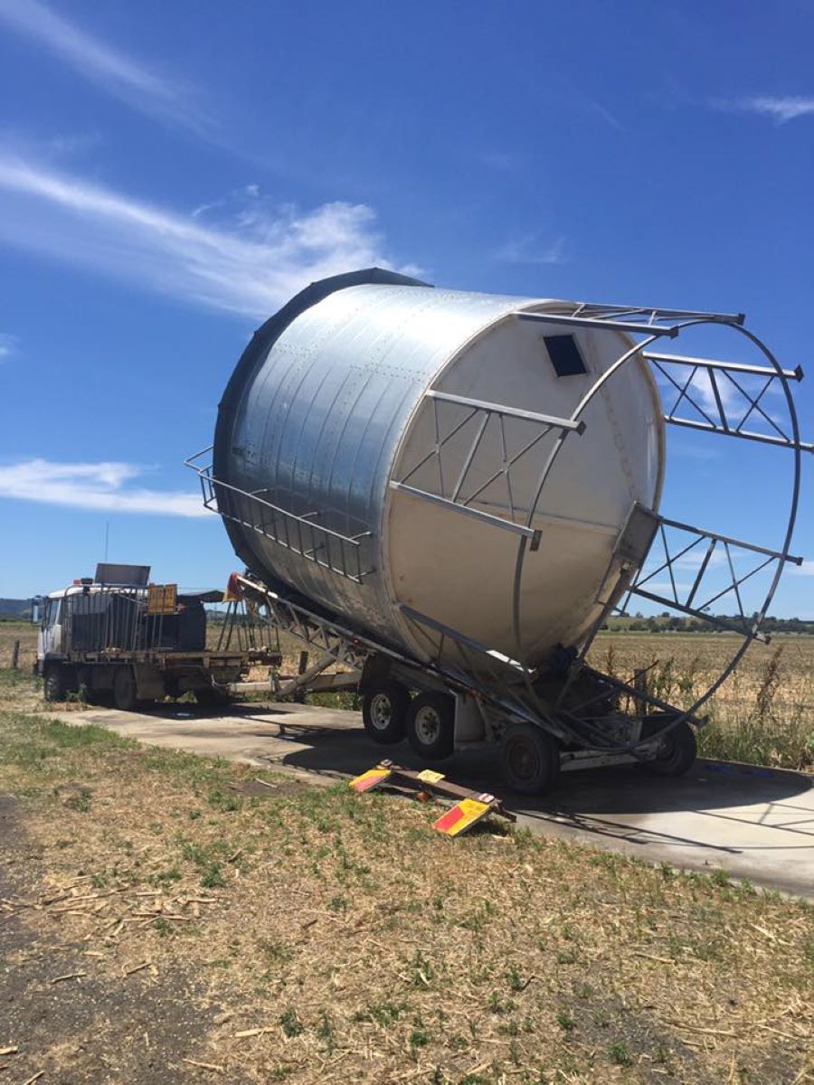 A Large Tank is Being Loaded on a Trailer — Wallamore Grain & Produce In Armidale, NSW
