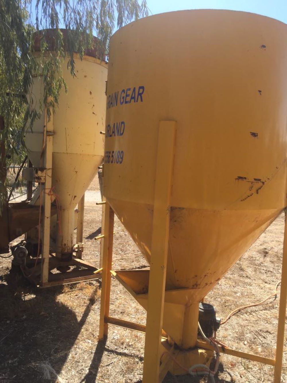 A Yellow Silo With the Word Gear on It — Wallamore Grain & Produce In Gunnedah, NSW