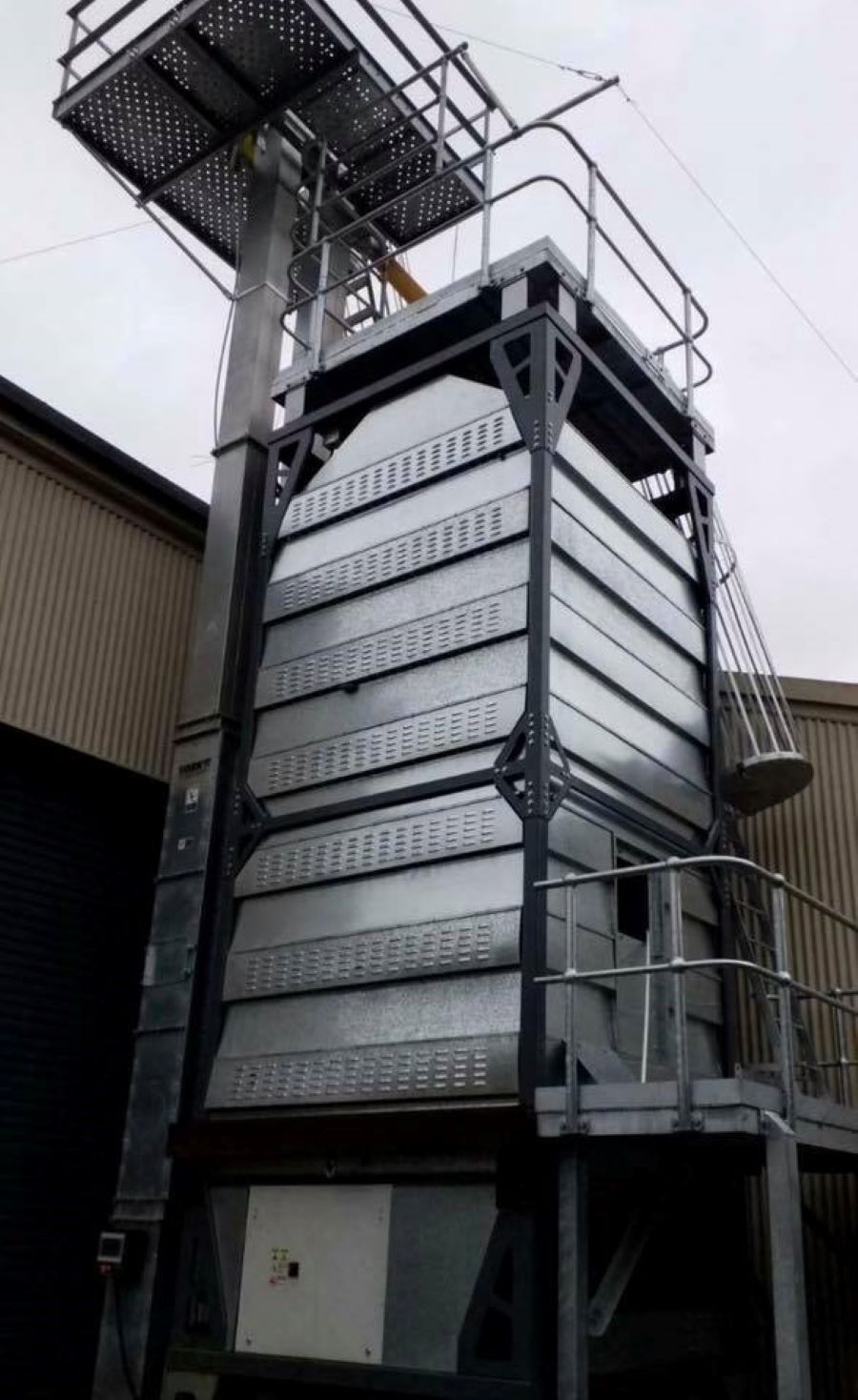 A Large Metal Structure With Stairs Leading Up to It — Wallamore Grain & Produce In Wallamore, NSW