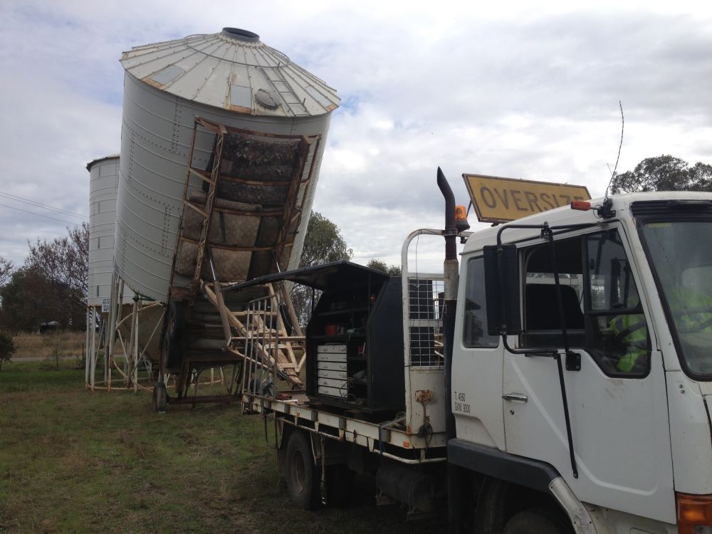 A White Truck Transporting A Silo — Wallamore Grain & Produce In Quirindi, NSW