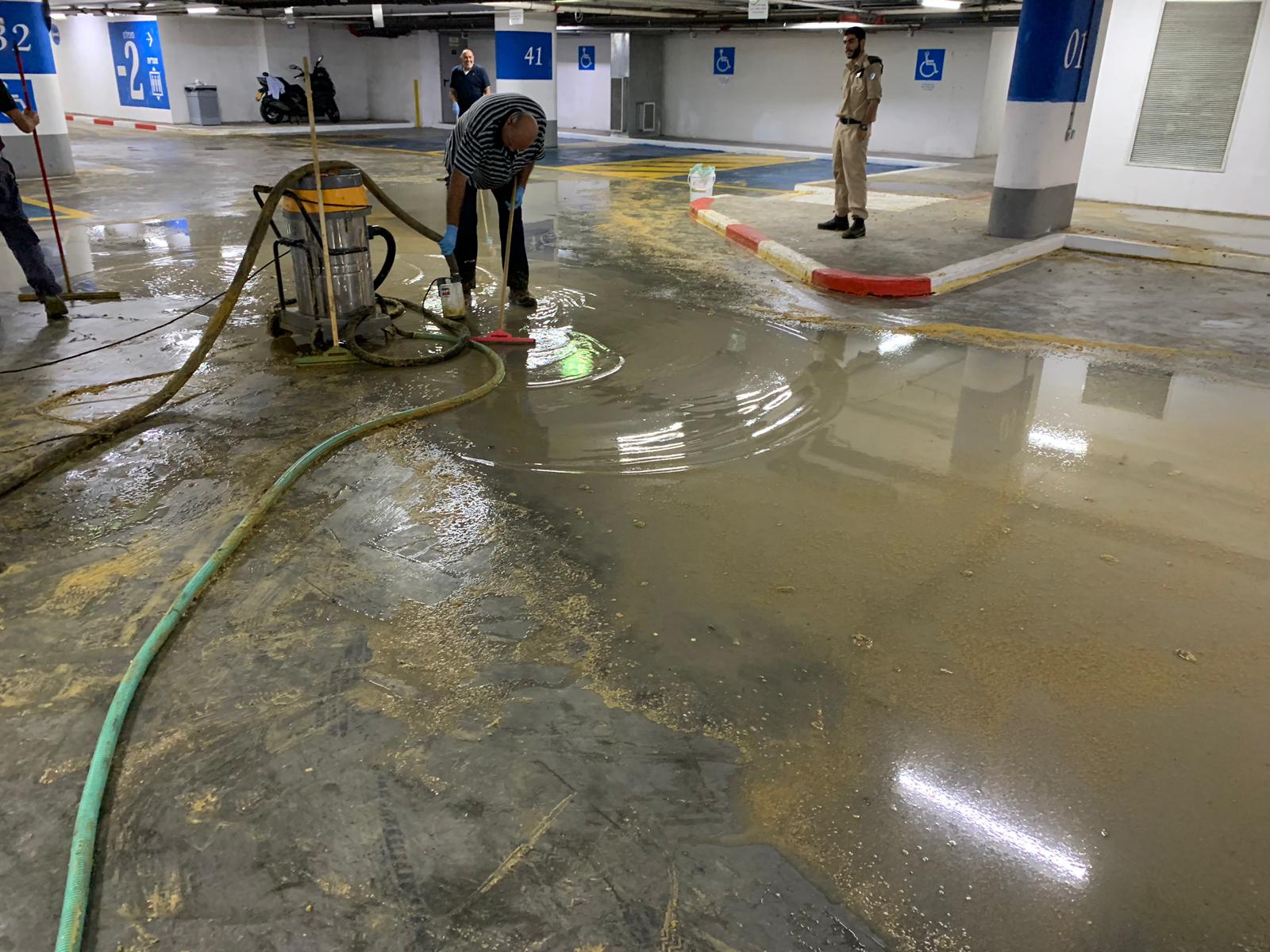 fresh and clean team vacuuming the flooded area