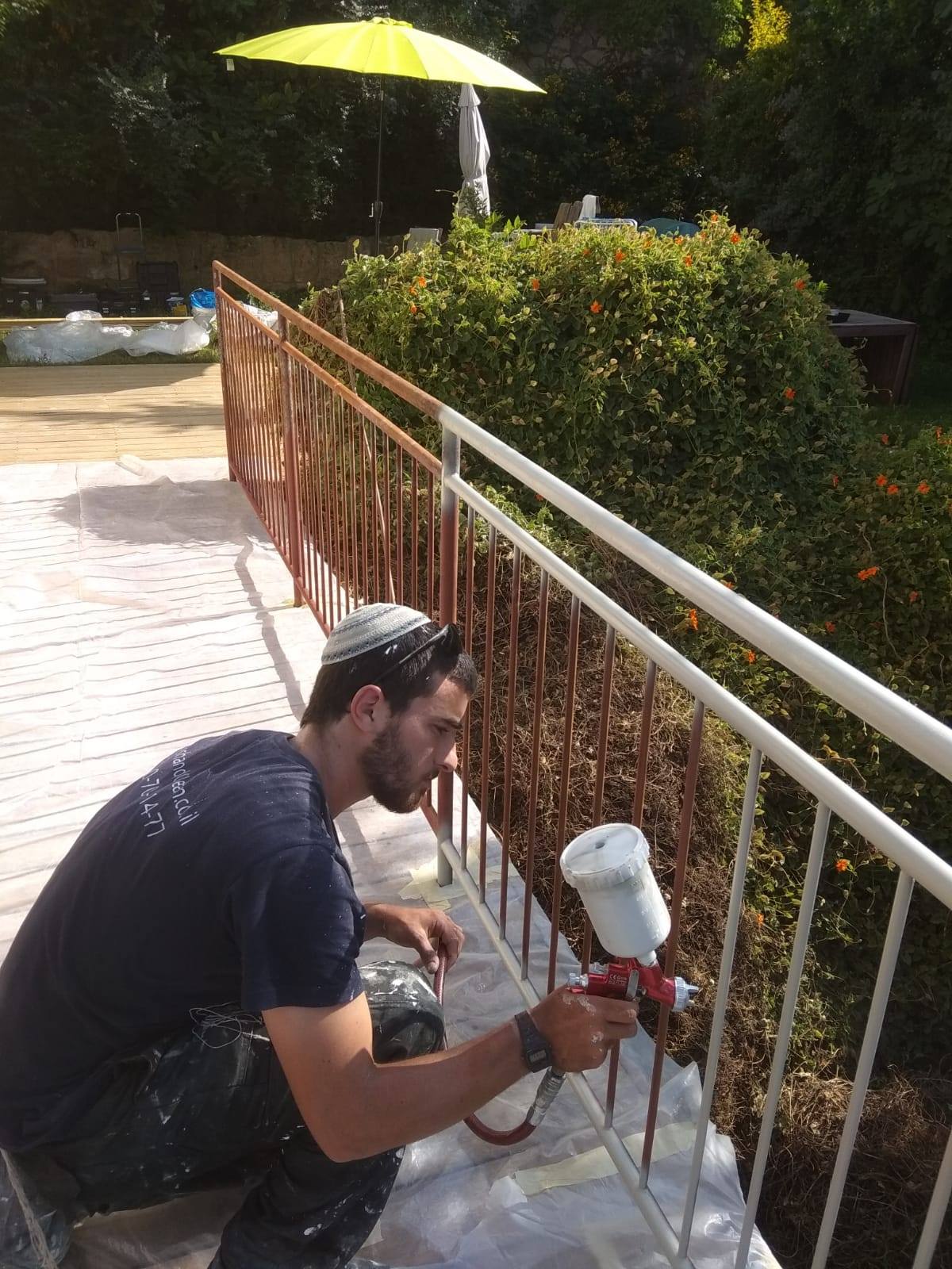 exterior painting of a metal fence
