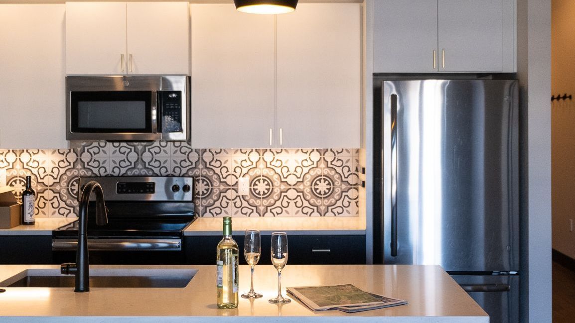 Modern photo of kitchen and kitchen island