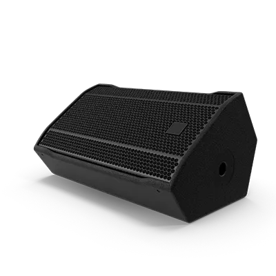 A black speaker is sitting on a white surface