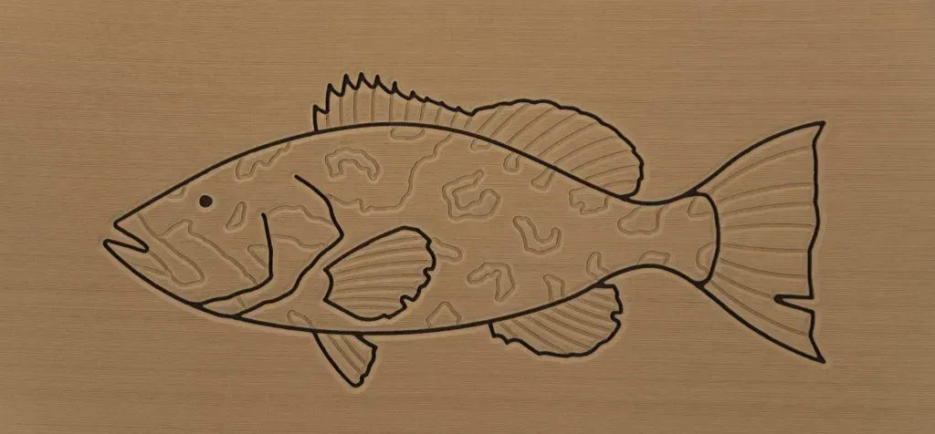 Relief carving of a fish on wood.