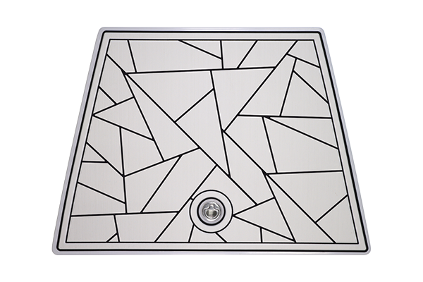 White and black geometric sink with drain.