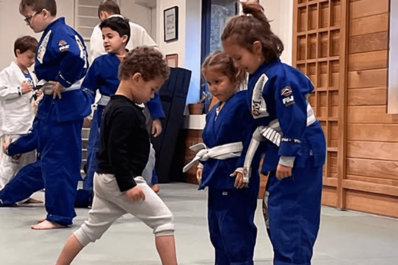 Kids practicing controlled grappling drills at OM Brazilian Jiu JItsu & Judo in Northport, NY to build self-discipline