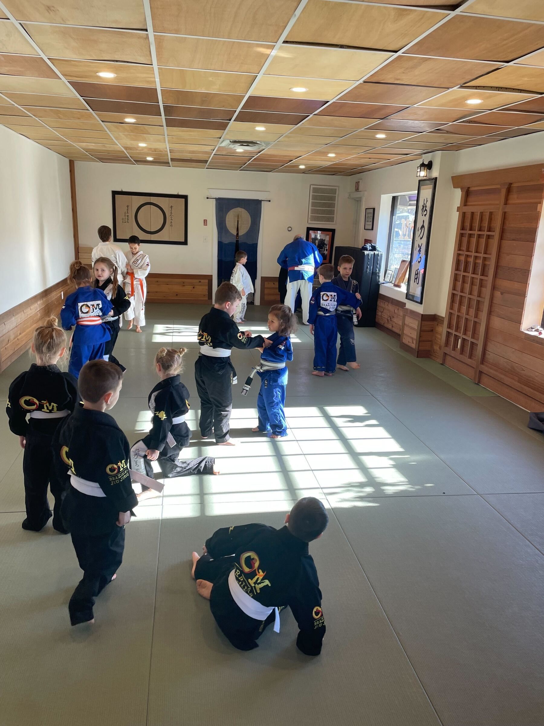 Kids practice safe grappling drills at OM Brazilian Jiu JItsu & Judo in Northport, NY.