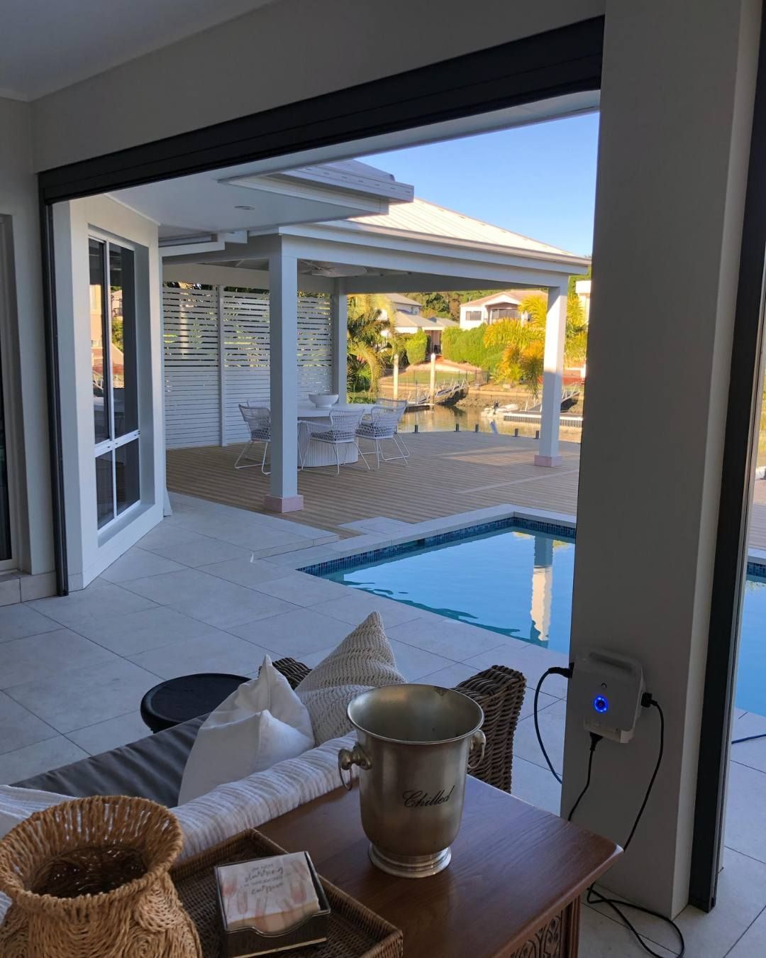 A living room with a swimming pool in the background — Solo Reno Coatings In Gold Coast, QLD