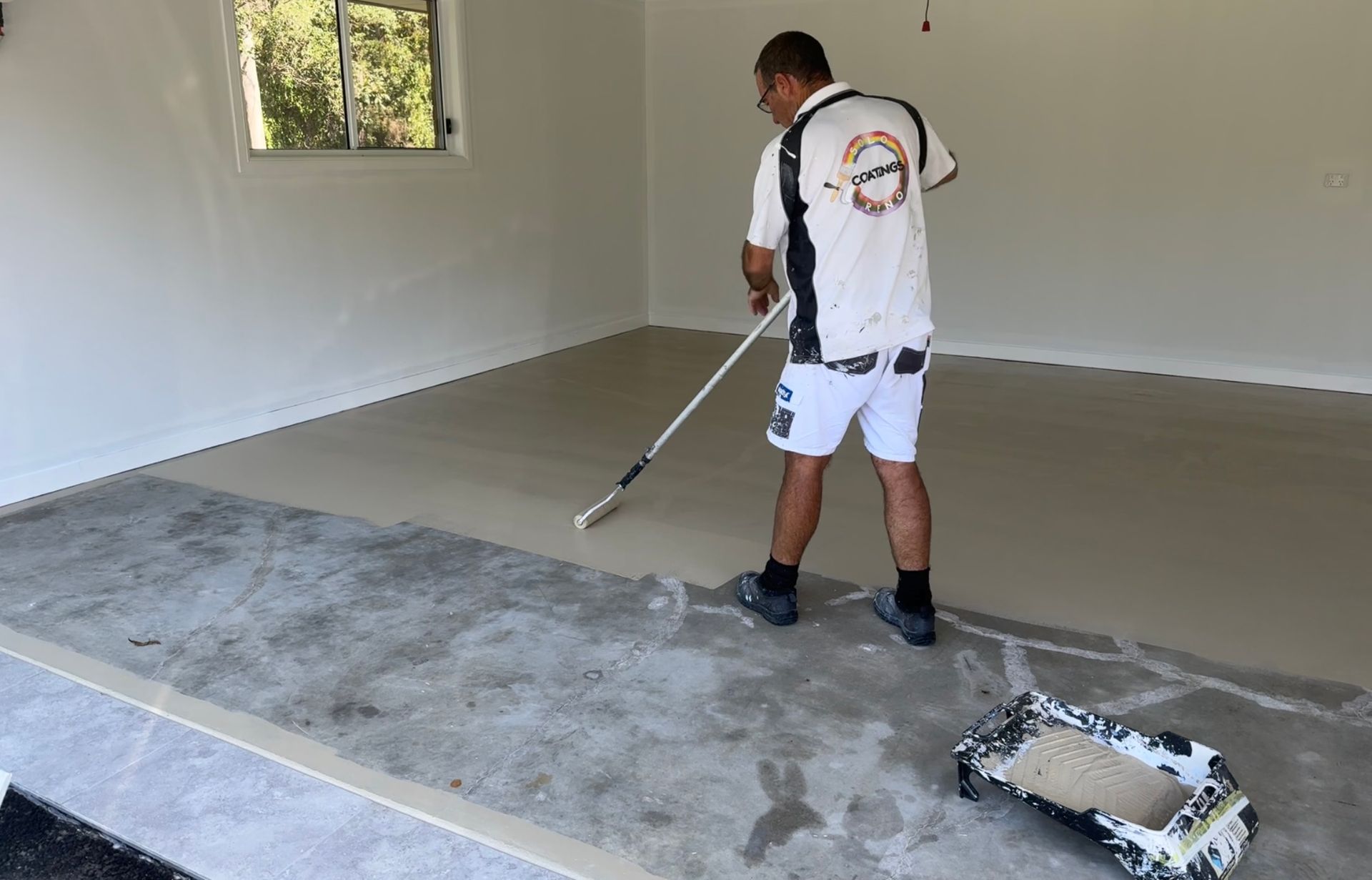 A Bunch Of Paint Cans And Brushes On A Table — Solo Reno Coatings In Gold Coast, QLD