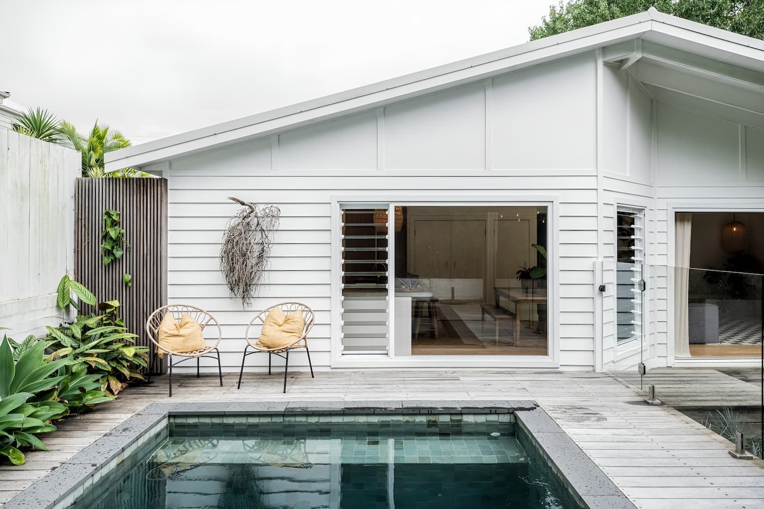 A White House With A Swimming Pool In Front Of It — DeBu Studios In Russell Vale, NSW