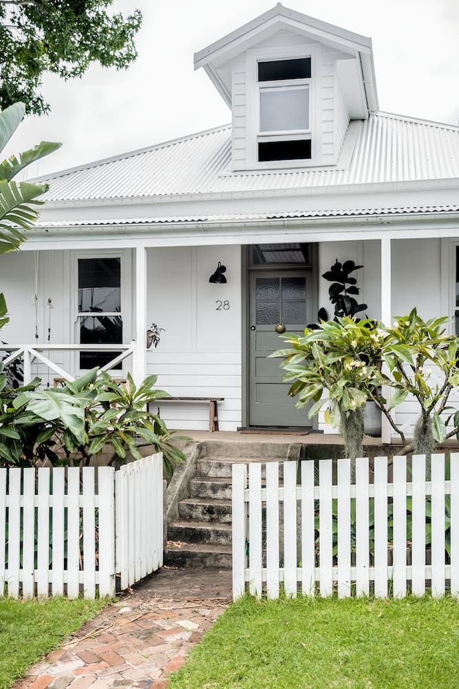 A White House With A White Picket Fence In Front Of It — DeBu Studios In Russell Vale, NSW