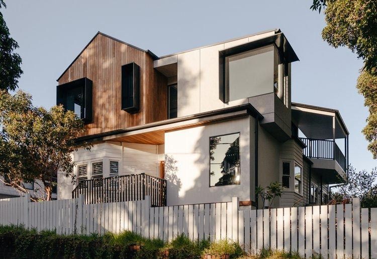 A Large House With a White Fence in Front of It — DeBu Studios In Russell Vale, NSW