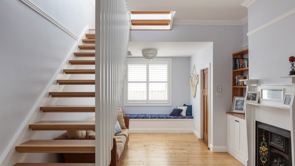 A Wooden Staircase Leading Up to the Second Floor of a House — DeBu Studios In Russell Vale, NSW