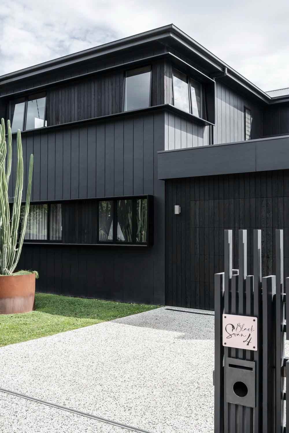 A Black House With a Fence in Front of It — DeBu Studios In Russell Vale, NSW