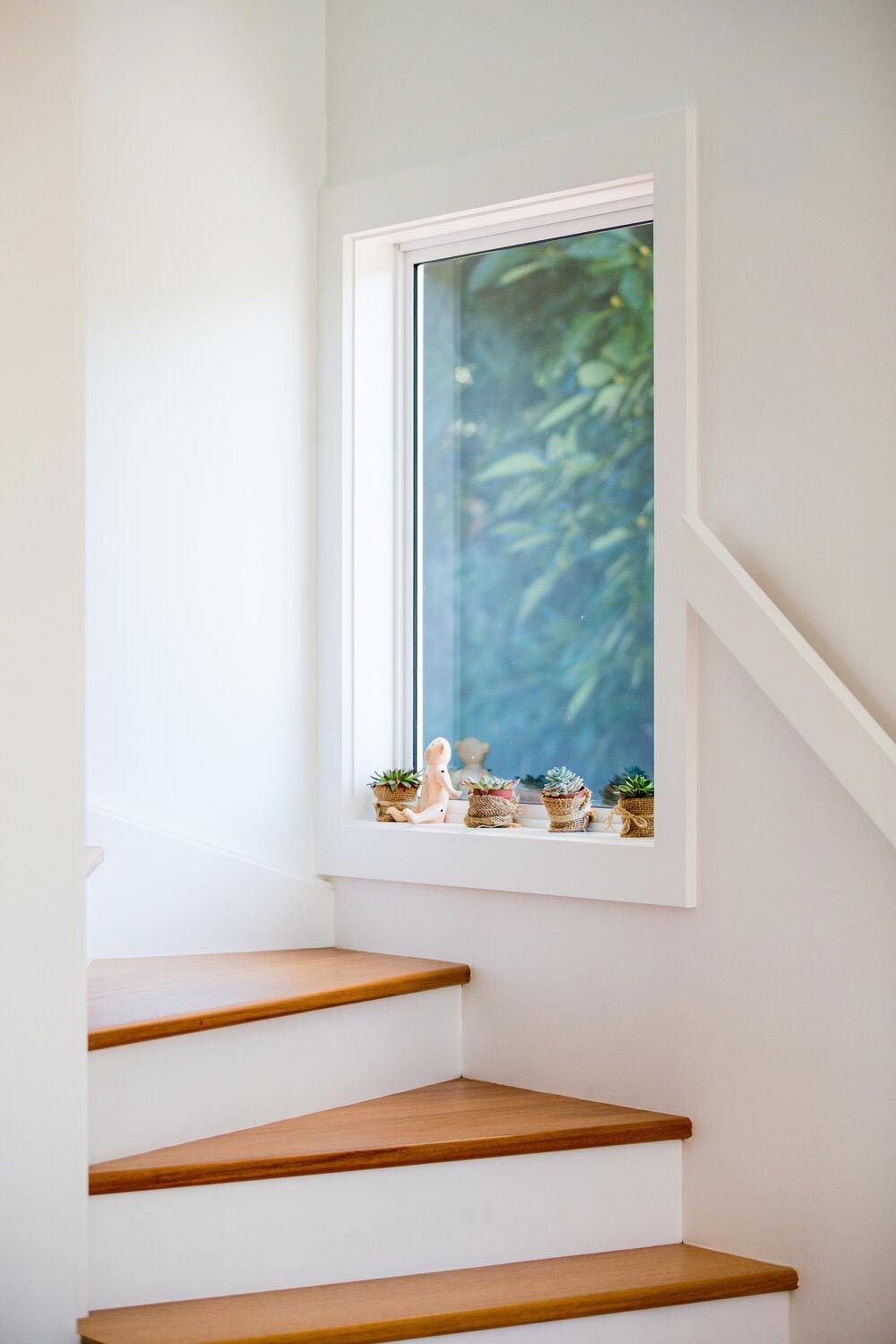 A Staircase With Wooden Steps and a Window in the Corner — DeBu Studios In Russell Vale, NSW