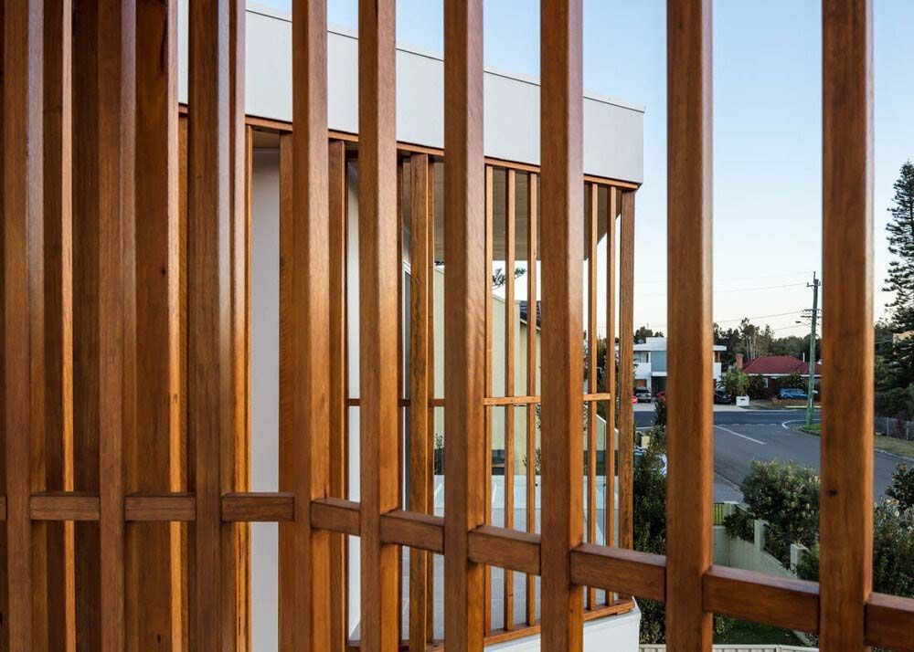 A Wooden Fence is Surrounding a Building With a Lot of Windows — DeBu Studios In Russell Vale, NSW