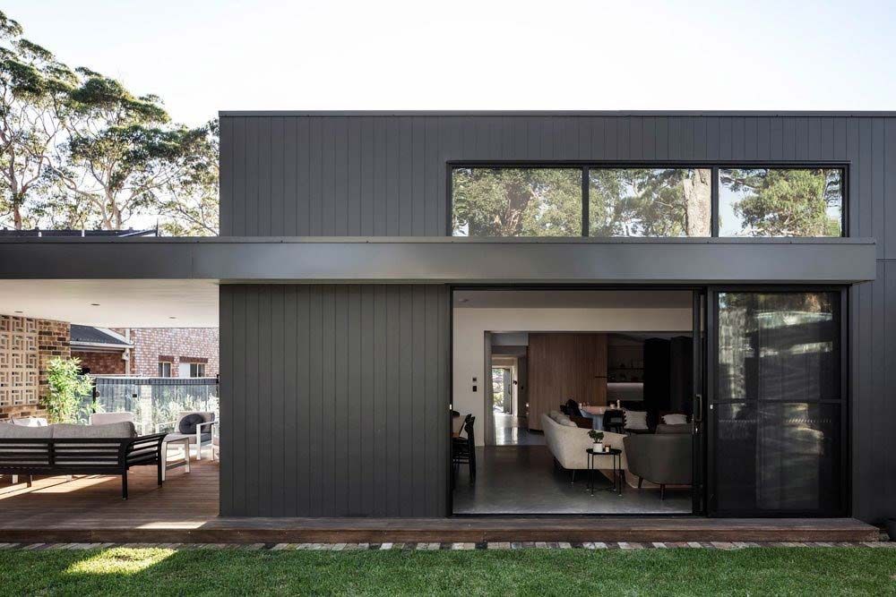 A Black House With a Lot of Windows and a Sliding Glass Door — DeBu Studios In Russell Vale, NSW