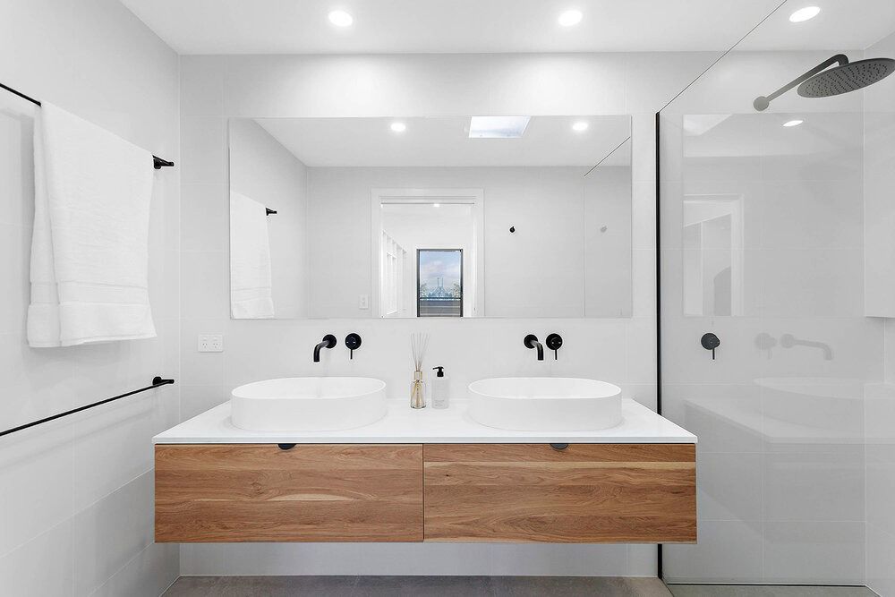A Bathroom With Two Sinks and a Large Mirror — DeBu Studios In Russell Vale, NSW
