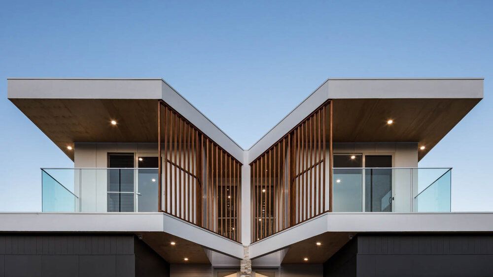 A Modern House With Two Balconies and a Blue Sky in the Background — DeBu Studios In Russell Vale, NSW
