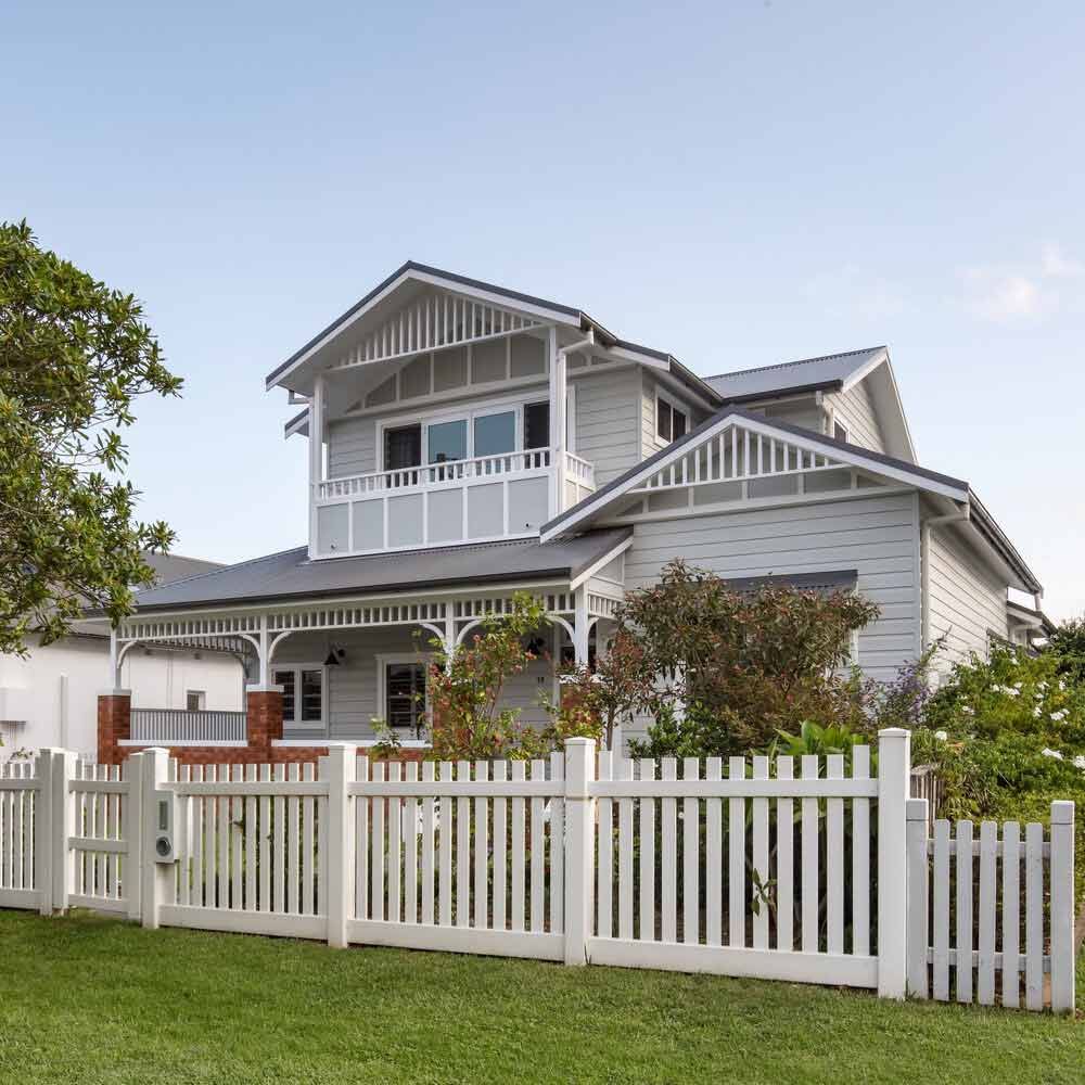 A White House With a White Picket Fence in Front of It — DeBu Studios In Russell Vale, NSW