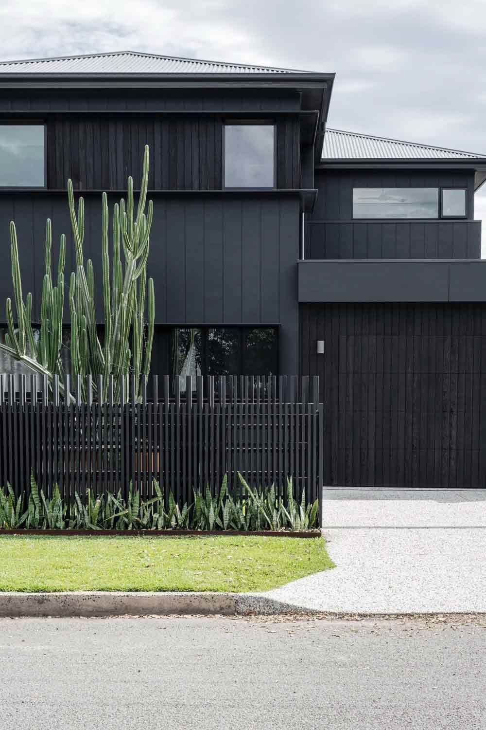 A Black House With a Black Fence and a Black Garage Door — DeBu Studios In Russell Vale, NSW