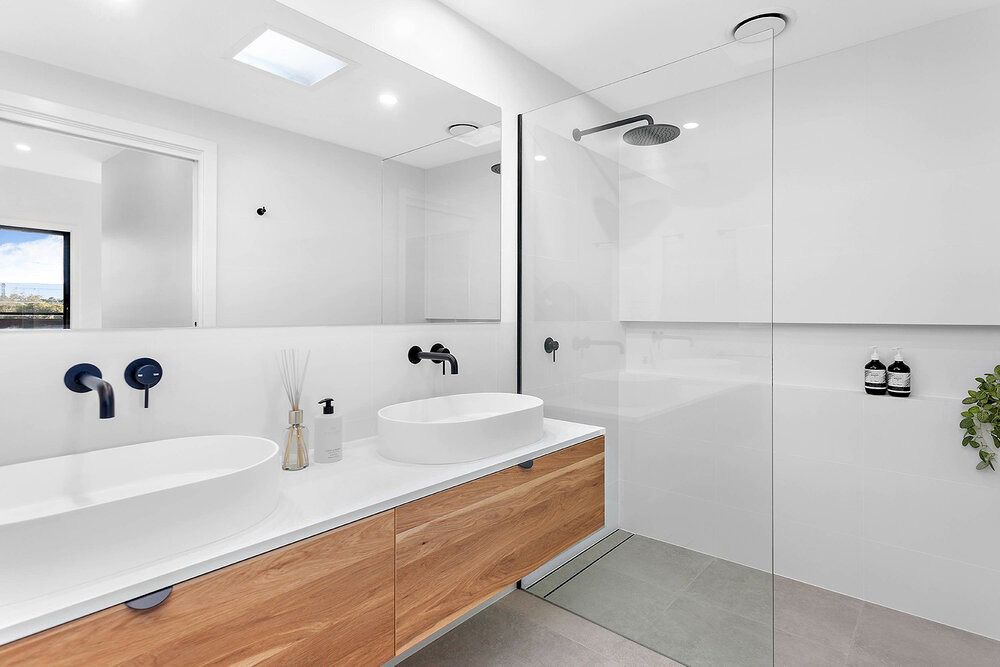 A Bathroom With Two Sinks and a Walk in Shower — DeBu Studios In Russell Vale, NSW