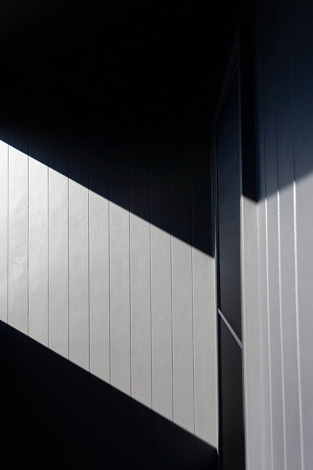 A Black and White Wall With a Diagonal Stripe on It — DeBu Studios In Russell Vale, NSW