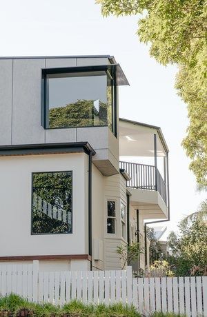A White House With a Balcony and a White Picket Fence — DeBu Studios In Russell Vale, NSW