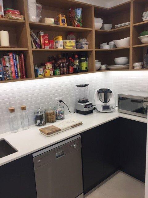 A Kitchen With Lots of Shelves and Appliances Including a Blender — DeBu Studios In Russell Vale, NSW