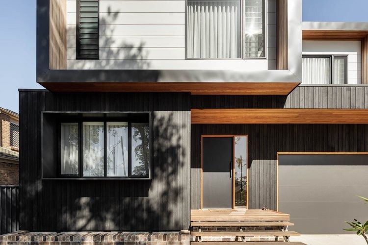 A Modern House With a Lot of Windows and a Garage — DeBu Studios In Russell Vale, NSW
