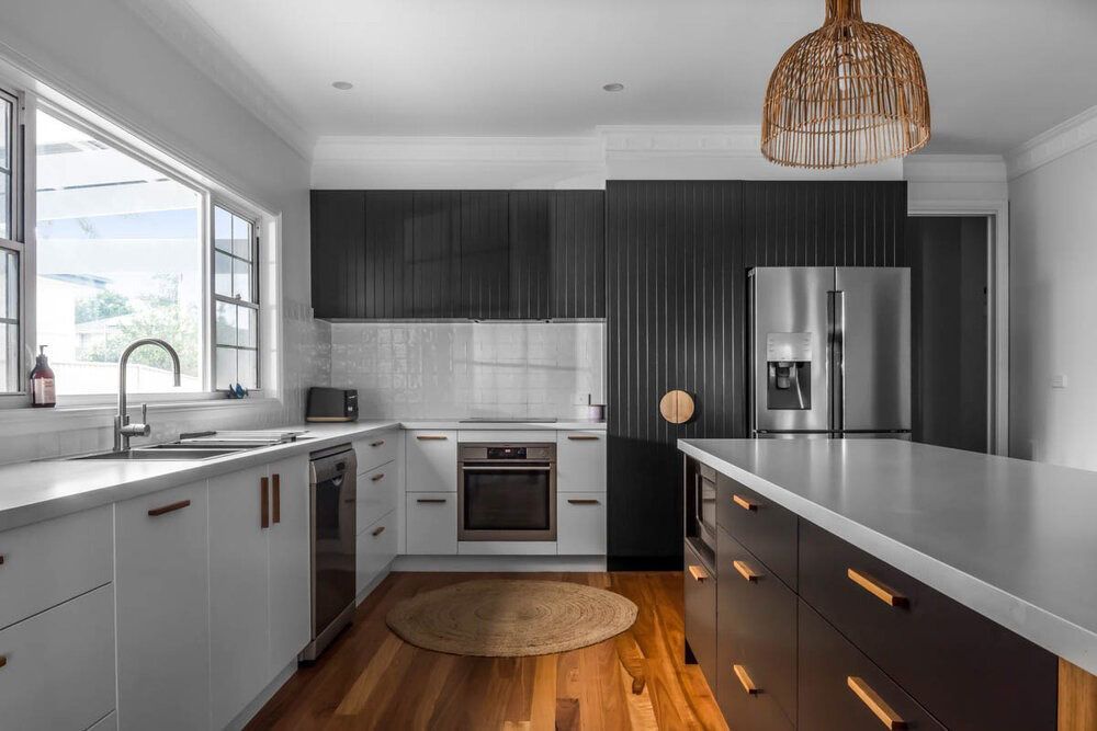 A Kitchen With Black Cabinets — DeBu Studios In Russell Vale, NSW