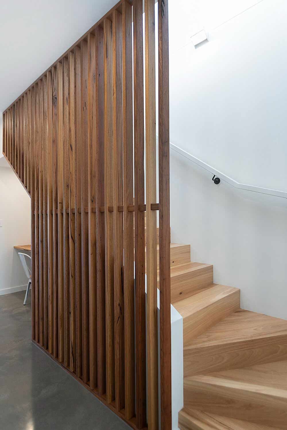 A Wooden Staircase With a Wooden Divider Between the Stairs — DeBu Studios In Russell Vale, NSW