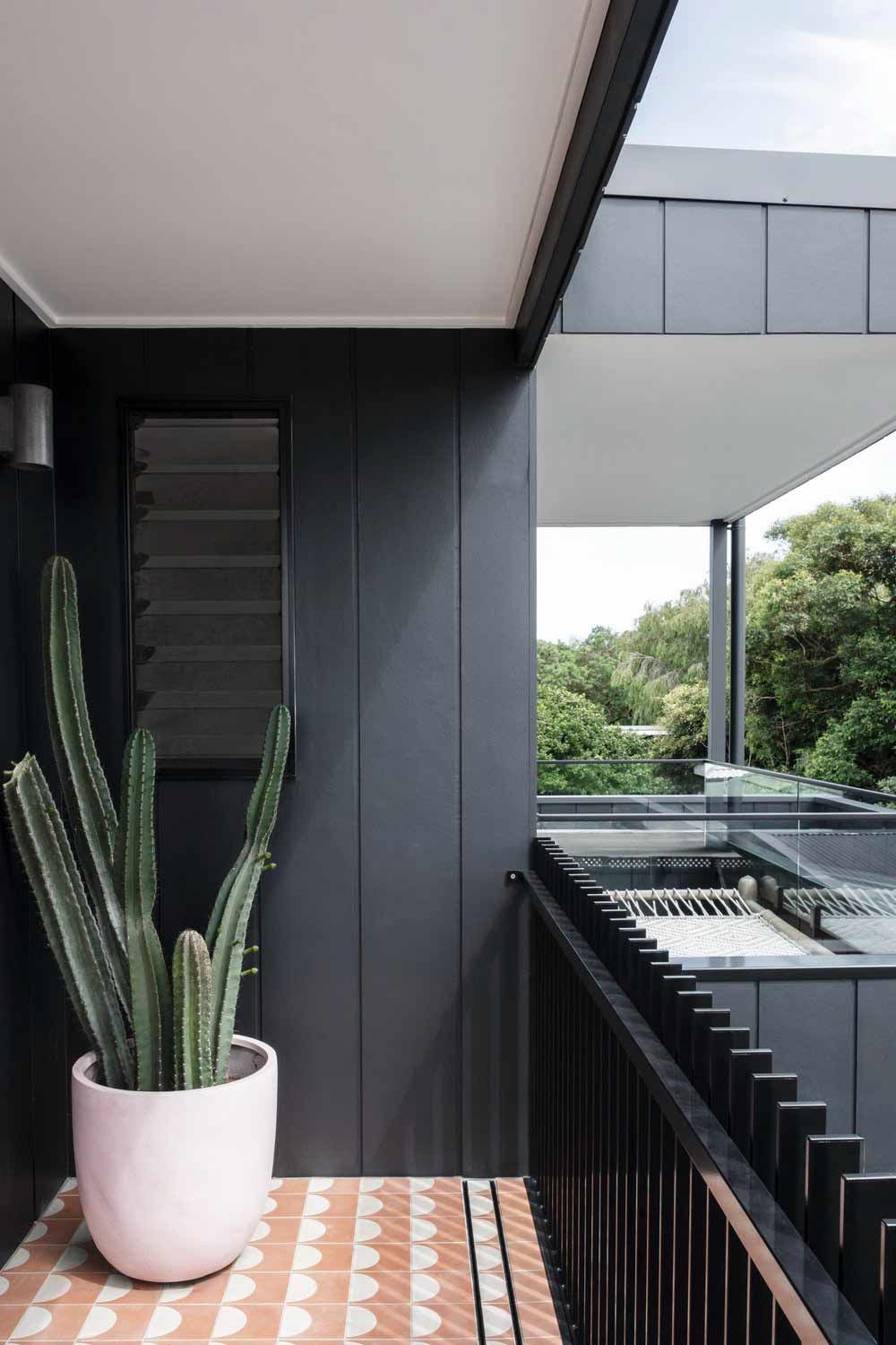 A Potted Plant is Sitting on a Table on a Balcony — DeBu Studios In Russell Vale, NSW