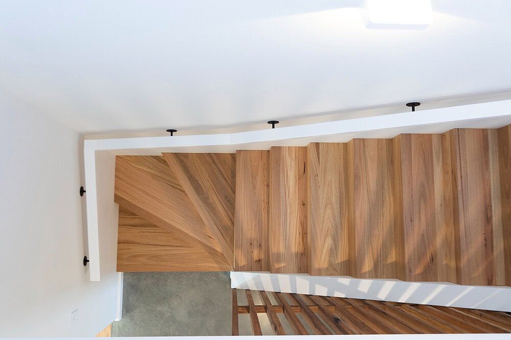 The Stairs Are Made of Wood and Have a White Railing — DeBu Studios In Russell Vale, NSW
