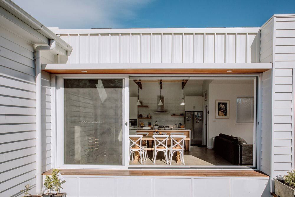 A Ceiling With Wooden Beams and White Lights Hanging From It — DeBu Studios In Russell Vale, NSW