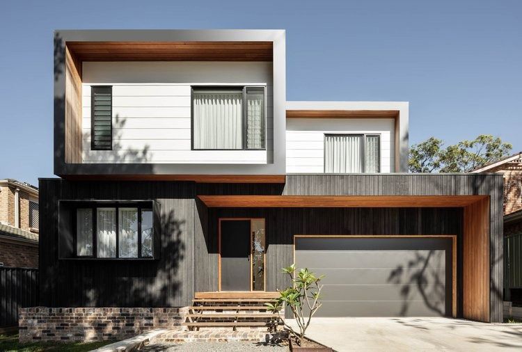 A Modern House With a Garage and Stairs in Front of It — DeBu Studios In Russell Vale, NSW