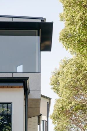 A Close Up of a House With a Large Window and a Tree in the Background — DeBu Studios In Russell Vale, NSW