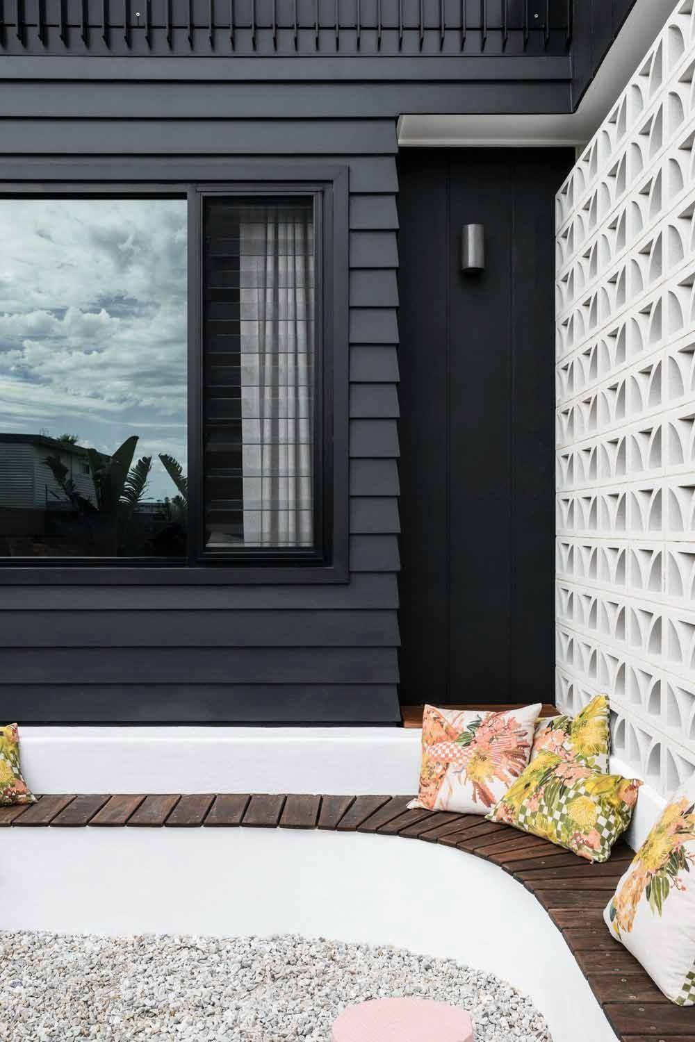 There is a Couch With Pillows on It in Front of a Window — DeBu Studios In Russell Vale, NSW