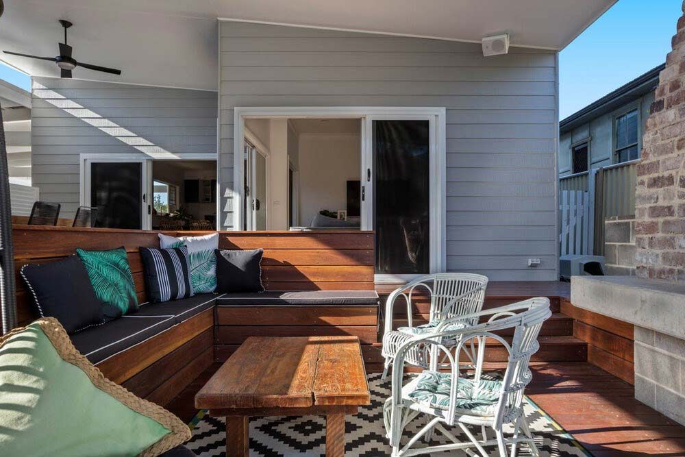 A Patio With a Wooden Bench — DeBu Studios In Russell Vale, NSW