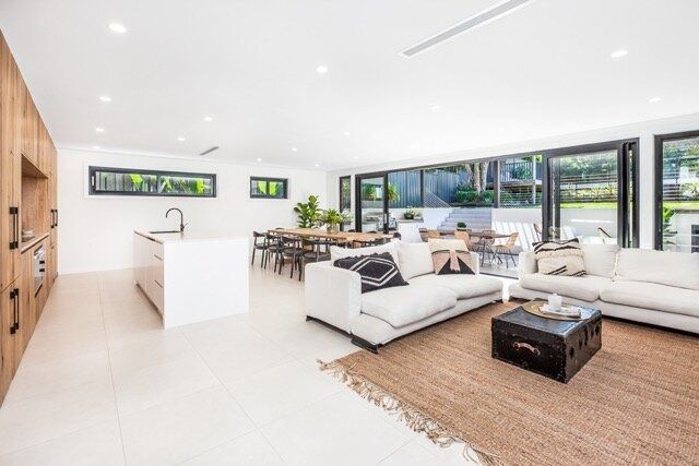 A Living Room With Two Couches, a Coffee Table, and a Large Window — DeBu Studios In Russell Vale, NSW