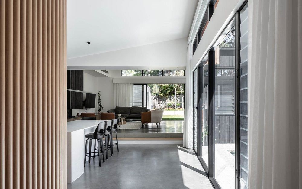 A Living Room With a Lot of Windows and Stools — DeBu Studios In Russell Vale, NSW