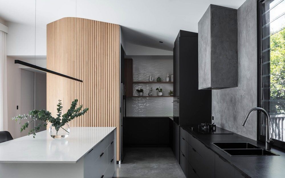 A Kitchen With Black Cabinets and a White Counter Top — DeBu Studios In Russell Vale, NSW