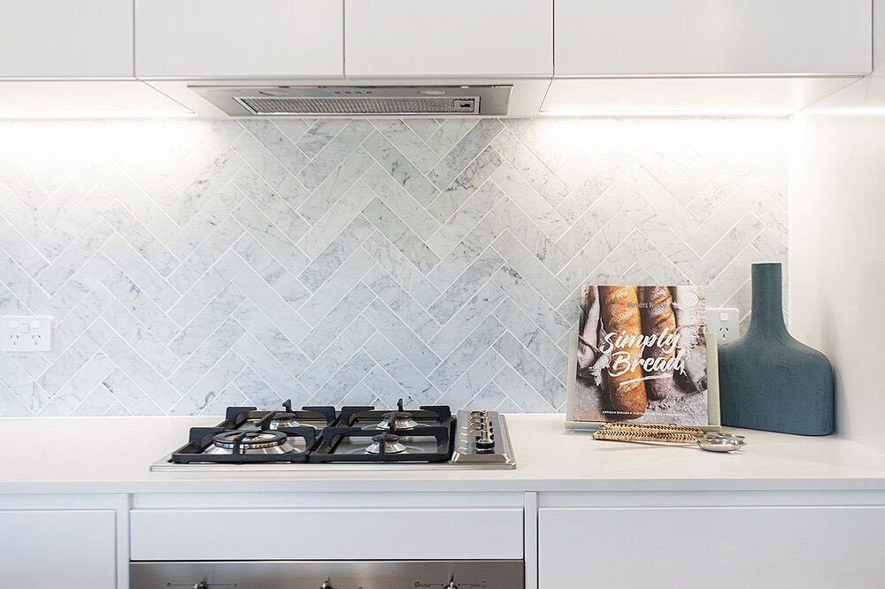 A Kitchen With a Stove and a Book on the Counter — DeBu Studios In Russell Vale, NSW