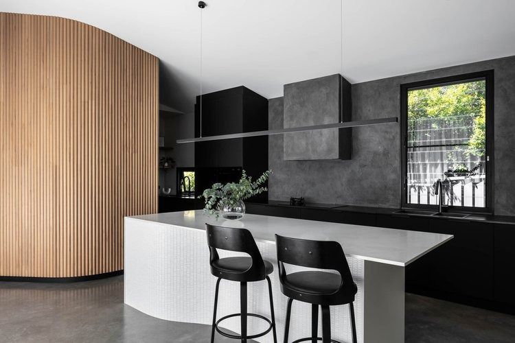 A Kitchen With a Large Island and Two Bar Stools — DeBu Studios In Russell Vale, NSW